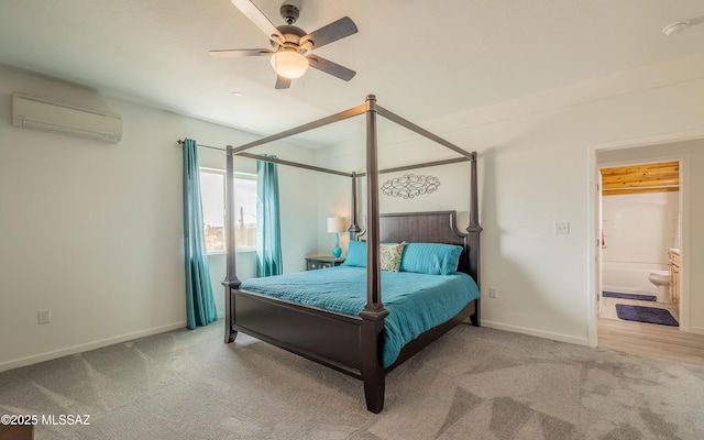 bedroom with a wall unit AC, a ceiling fan, baseboards, and carpet flooring