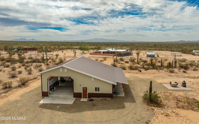 bird's eye view featuring a mountain view and view of desert