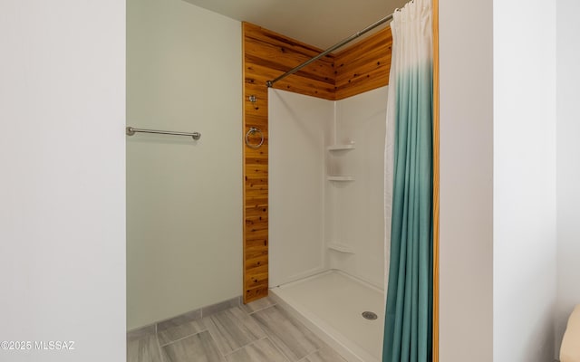 full bathroom featuring a shower stall