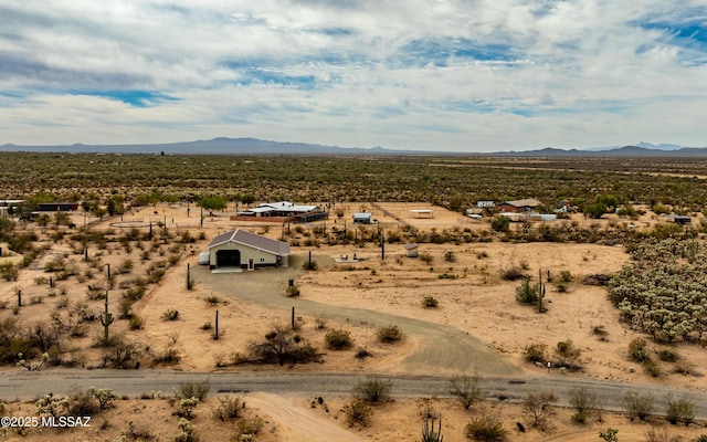 birds eye view of property with view of desert, a rural view, and a mountain view