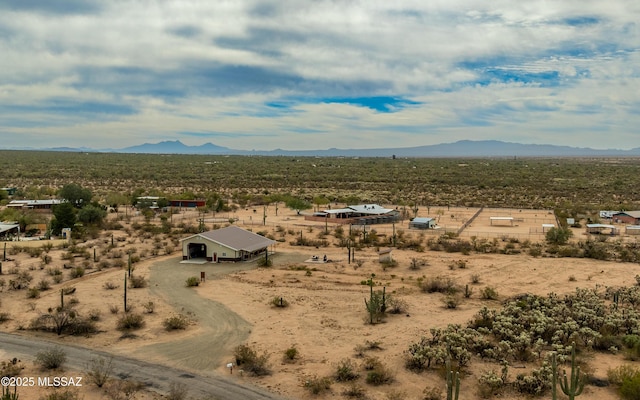 aerial view featuring a mountain view, a desert view, and a rural view