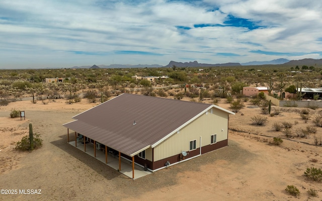 bird's eye view with a mountain view and view of desert