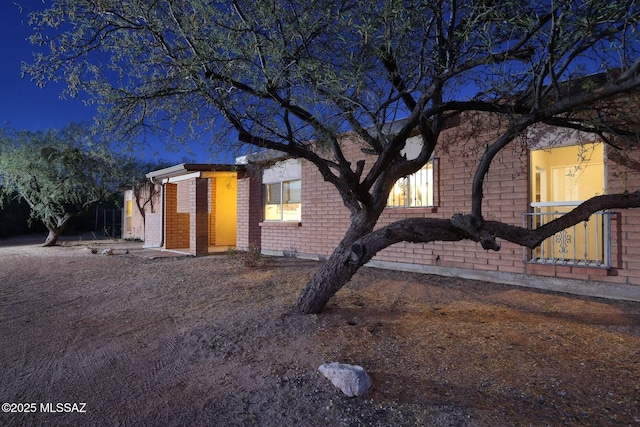 view of front of home featuring brick siding