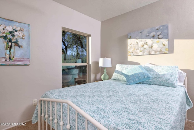 bedroom featuring baseboards and carpet flooring