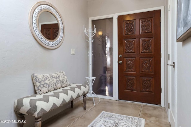 foyer entrance with tile patterned flooring