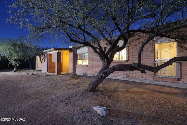 view of side of property with brick siding
