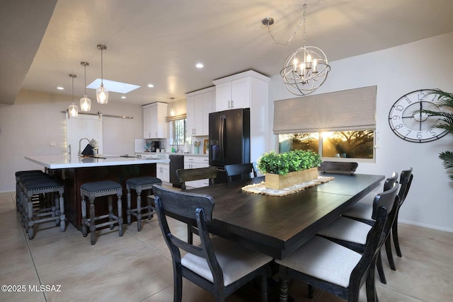 dining room featuring light tile patterned floors, baseboards, a chandelier, and recessed lighting