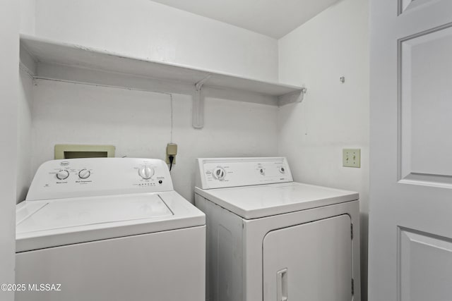 laundry area with washing machine and dryer and laundry area