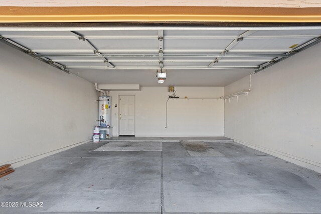 garage featuring water heater and a garage door opener