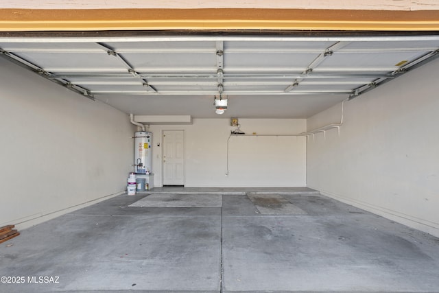 garage featuring gas water heater and a garage door opener