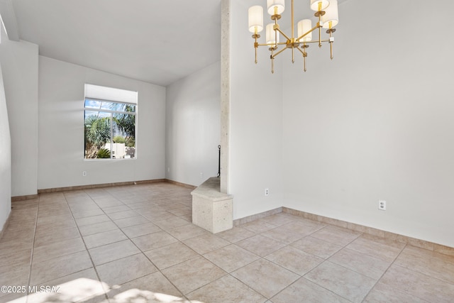 unfurnished room featuring baseboards, an inviting chandelier, and light tile patterned flooring