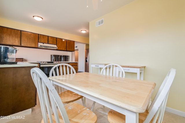 dining area with baseboards and visible vents