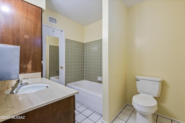 full bath featuring baseboards, visible vents, toilet, tile patterned flooring, and a bath