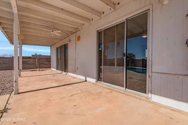 view of patio / terrace featuring fence and a ceiling fan