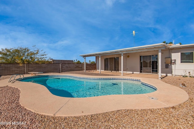 view of swimming pool featuring a patio, a fenced backyard, and a fenced in pool