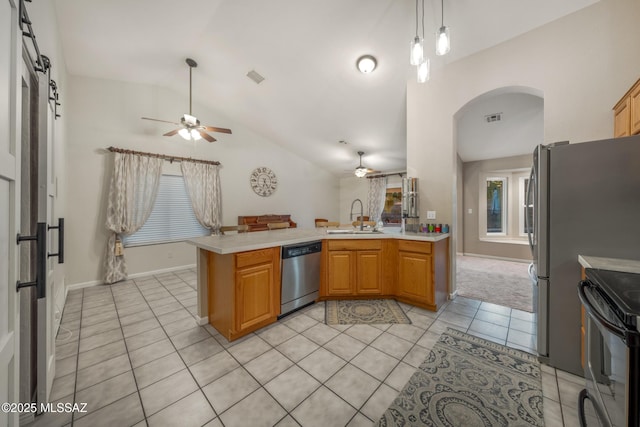 10117 E Sky Castle Way, Tucson, AZ 85730 - kitchen with a sink, arched walkways, ceiling fan, a peninsula, and appliances with stainless steel finishes