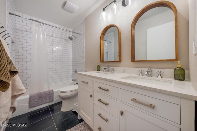 10117 E Sky Castle Way, Tucson, AZ 85730 - full bathroom featuring shower / bath combo with shower curtain, a sink, toilet, and tile patterned flooring