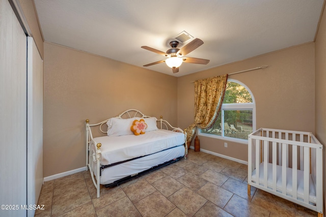 10117 E Sky Castle Way, Tucson, AZ 85730 - bedroom featuring baseboards, visible vents, tile patterned floors, and a ceiling fan