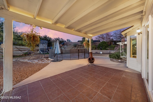 10117 E Sky Castle Way, Tucson, AZ 85730 - patio terrace at dusk featuring fence