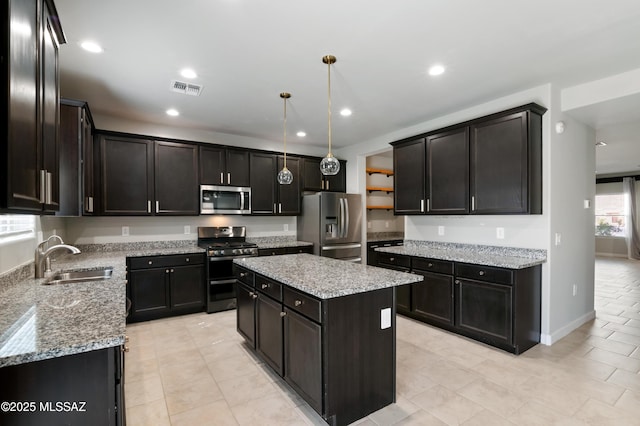 kitchen with visible vents, recessed lighting, a sink, appliances with stainless steel finishes, and a center island