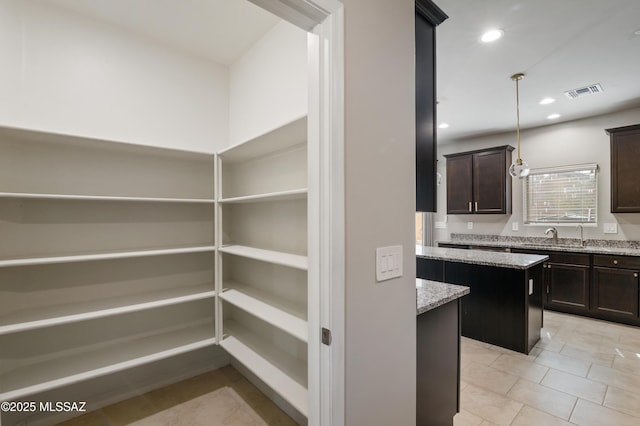 pantry with a sink and visible vents