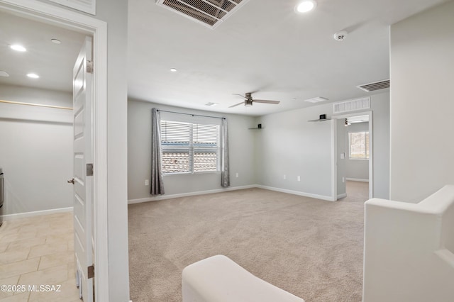 interior space featuring light carpet, visible vents, and ceiling fan