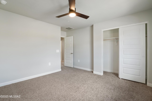 unfurnished bedroom with visible vents, baseboards, carpet, a closet, and a ceiling fan