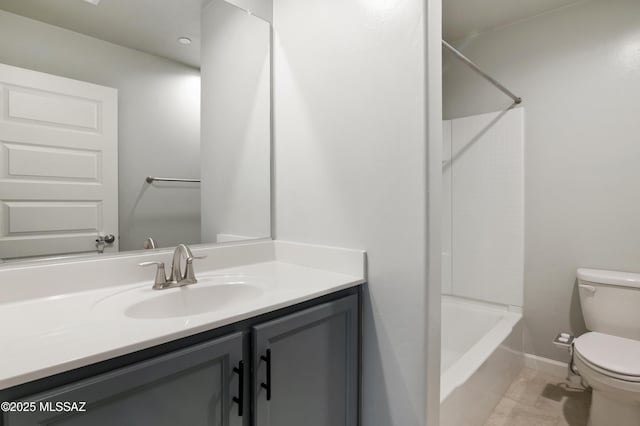 bathroom with baseboards, toilet, shower / tub combination, tile patterned floors, and vanity