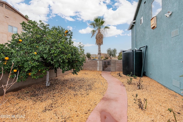 view of yard featuring a gate and fence