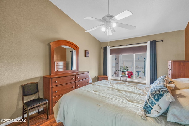 bedroom with lofted ceiling, wood finished floors, and ceiling fan