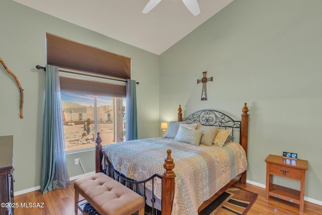 bedroom featuring baseboards, a ceiling fan, lofted ceiling, and wood finished floors