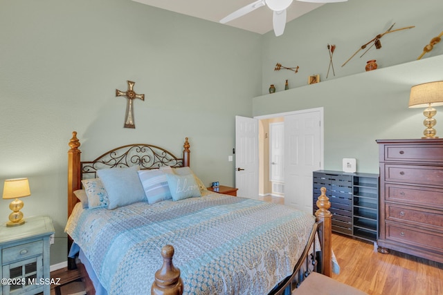 bedroom with light wood-style flooring and baseboards