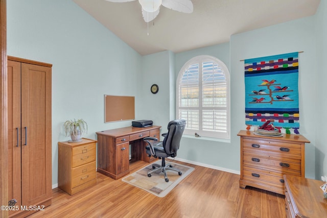 home office featuring vaulted ceiling, light wood-style flooring, baseboards, and ceiling fan