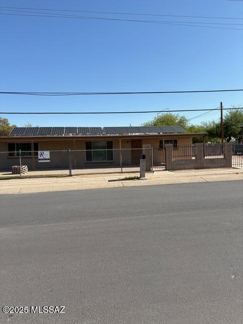 302 W Aragon Rd, Tucson, AZ 85756 - single story home with a fenced front yard
