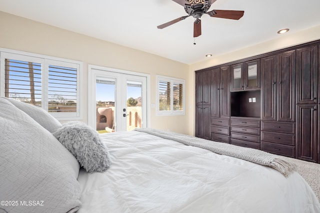 bedroom with recessed lighting, french doors, multiple windows, and access to outside