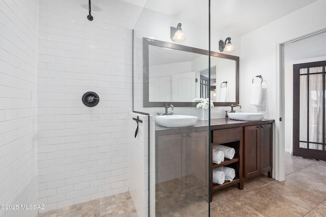 bathroom featuring a sink and walk in shower