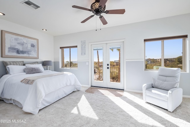 carpeted bedroom featuring access to exterior, visible vents, french doors, and baseboards