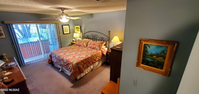 bedroom featuring a textured ceiling, a ceiling fan, and carpet flooring