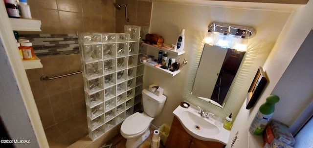 full bathroom with a walk in shower, vanity, and toilet