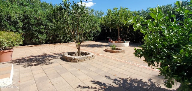 view of patio / terrace featuring a fire pit