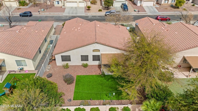 birds eye view of property with a residential view