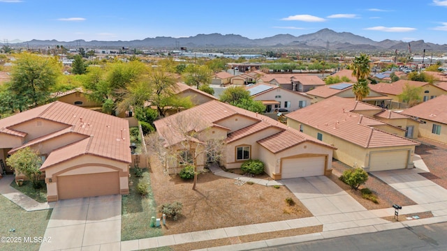 drone / aerial view with a residential view and a mountain view