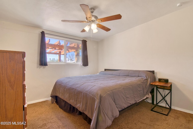 bedroom featuring ceiling fan, carpet floors, and baseboards