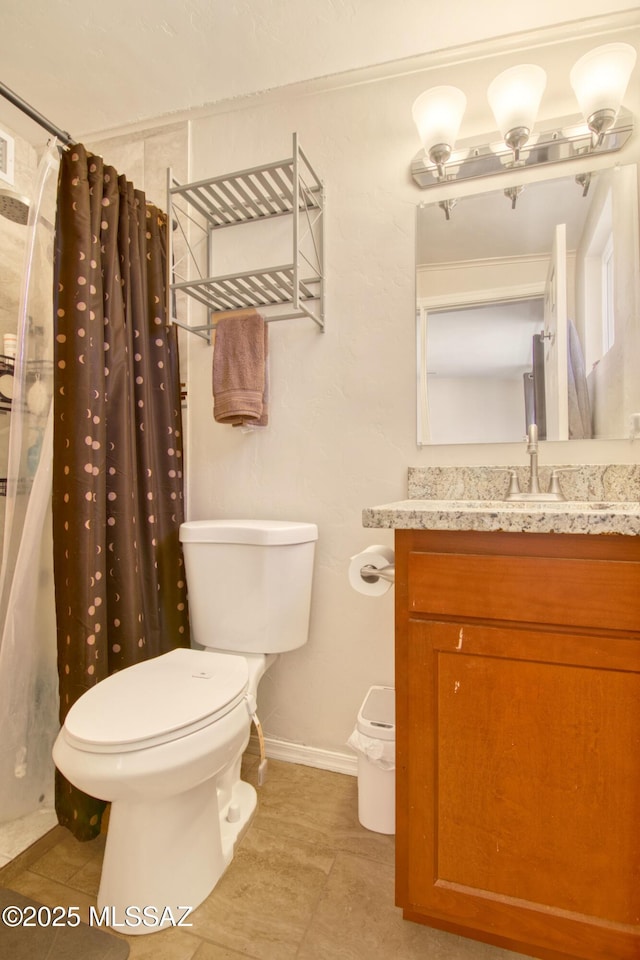 full bathroom with curtained shower, vanity, toilet, and baseboards