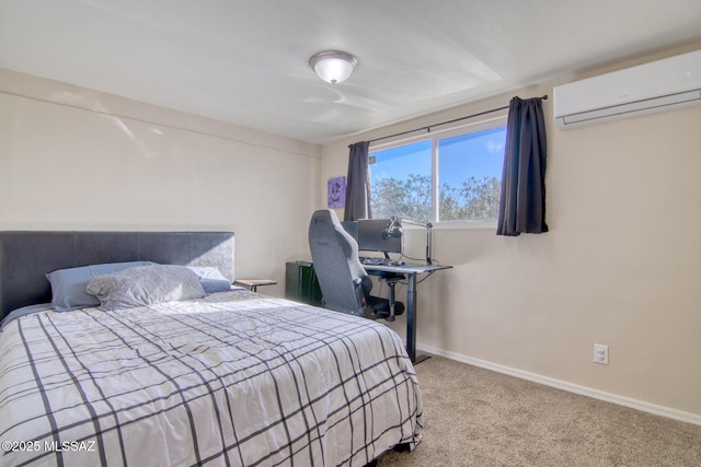 bedroom with carpet floors, baseboards, and a wall mounted AC