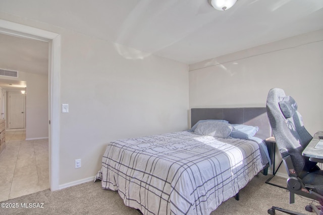 bedroom with carpet, visible vents, and baseboards