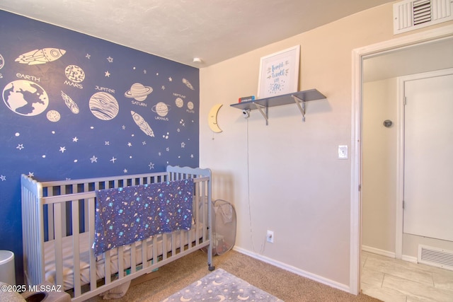 unfurnished bedroom with baseboards and visible vents