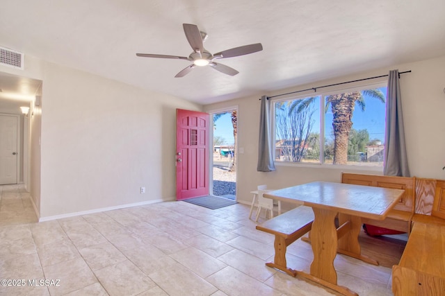 dining space featuring a ceiling fan, visible vents, and baseboards