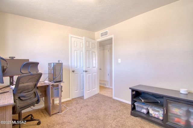 office area featuring carpet, visible vents, and baseboards