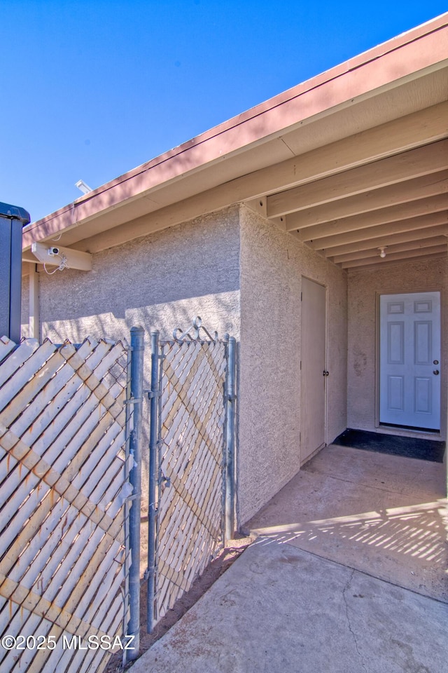 view of gate featuring fence